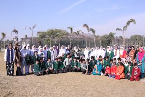 Group photo of students and staff from Shakarganj Evergreen School gathered outdoors during a school event.